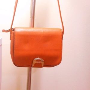 Orange cross bag with free Ray-Ban sunglasses